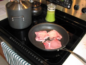 Browning the pork chops for the sauce
